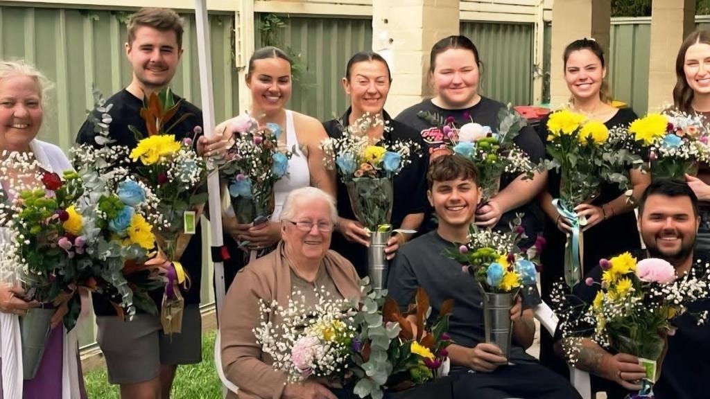The whole family holding their handpicked bouquets
