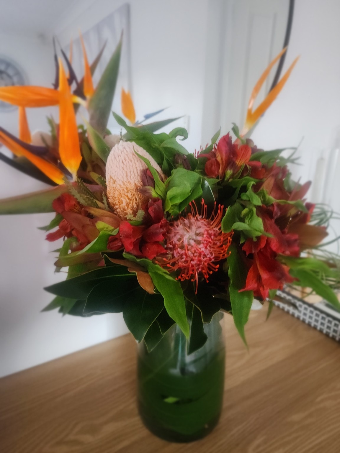Anthurium and fern floral arrangement by Sunny Luxe