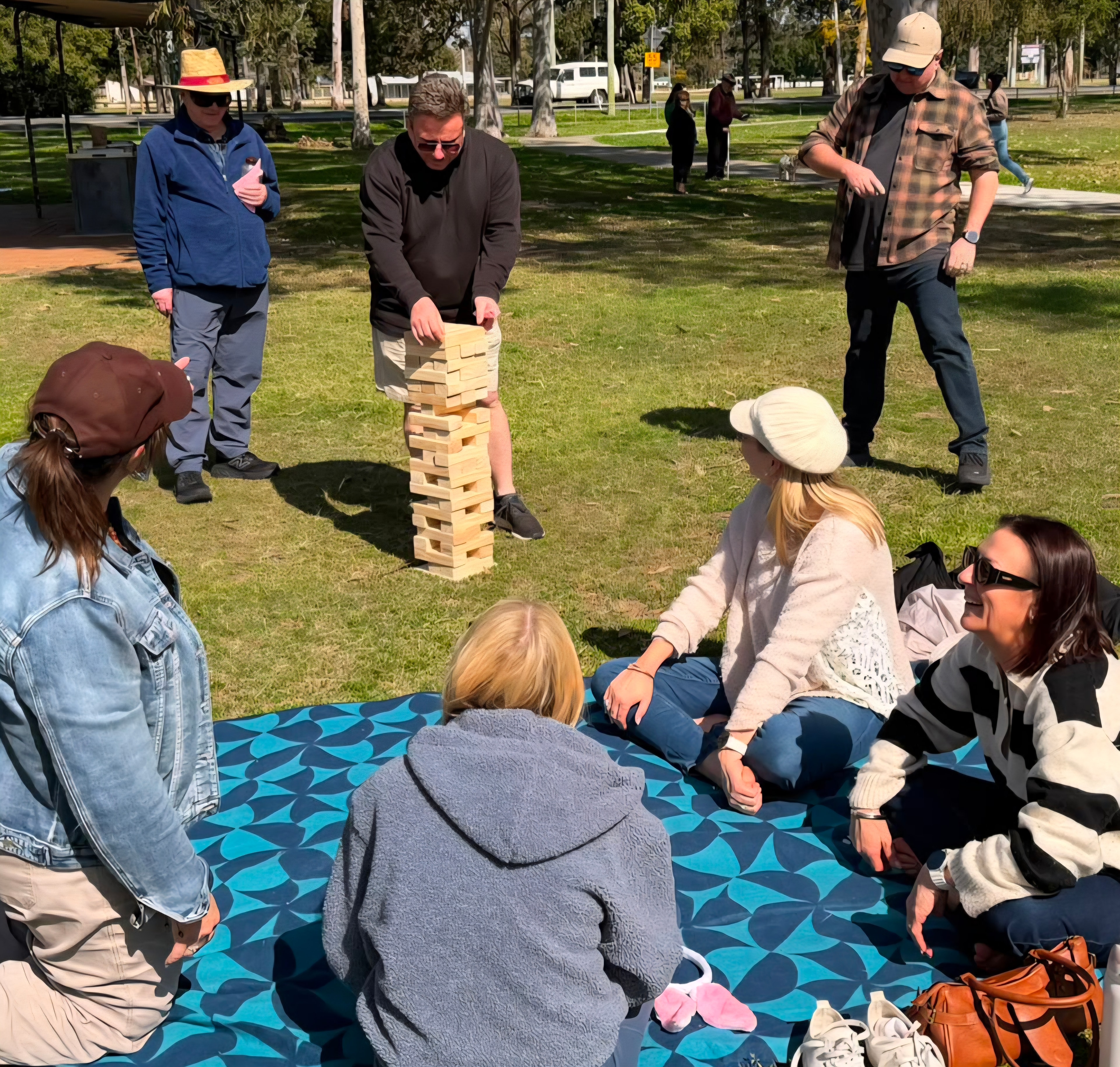 Guests playing Giant Block Tower at a Sunny Luxe event